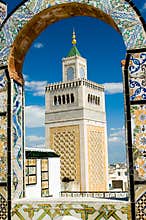 Mosque tower - framed with ornamental arch in Tunis