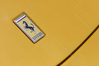 Ferrari logo on yellow sport car
