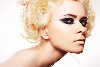 Woman with blond hair and rock evening make-up