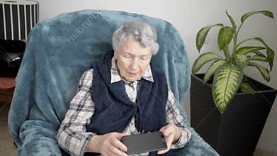 Retired woman is very disappointed because she cannot use a smartphone