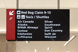 Airport Baggage Claim and Taxi Shuttle Sign