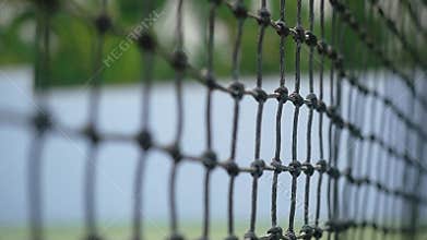 Mesh on the tennis court in sunny day. changes focus. Close-up. slow motion. 1920x1080