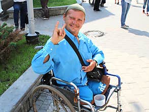 An example of optimism and strength of mind from a disabled person in a wheelchair.