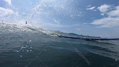 Amateur surfer rides the wave