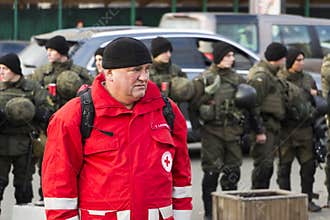 Kyiv, Ukraine, Independence Square, September 9: The Volunteer of the Red Cross stands near the building of the National