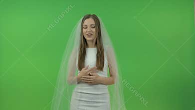 Beautiful bride on a green background.