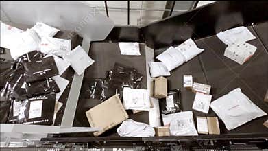 Huge amount of parcels bein transported on conveyor belts - time lapse 96 times faster