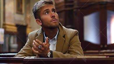Young man sitting in church