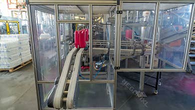 A factory for plastic canister production timelapse hyperlapse. The conveyor in the factory.