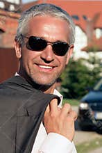 Mature businessman smiling outside
