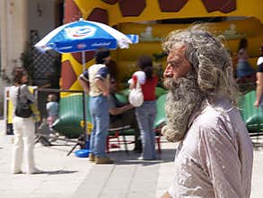 An old gray long-haired bearded man