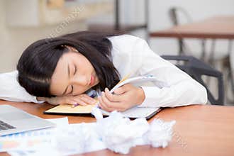 Asian woman with tired overworked and sleep, girl have resting while work writing note