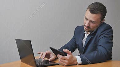 Businessman with the phone Tablet and laptop