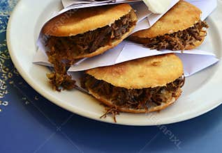 Arepas filled with shredded beef.Venezuelan typical dish.Traditional Colombian food.