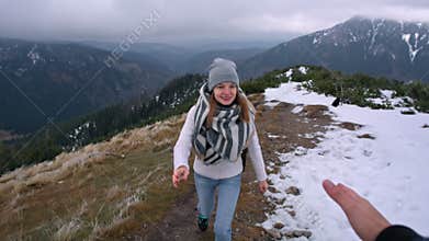 Lady is Climbing the Mountain and the Leader`s Hand is Helping Her to Climb