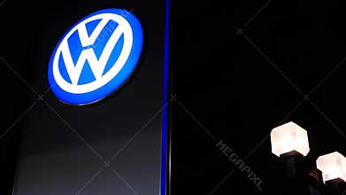 Motion of automobile dealership showroom with Volkswagen logo