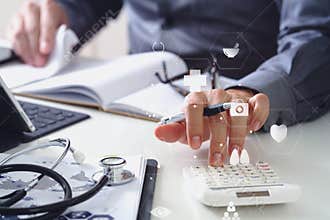 Healthcare costs and fees concept.Hand of smart doctor used a ca