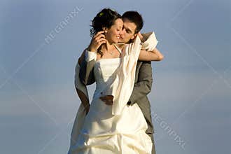 Newlywed couple embracing