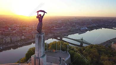 Budapest, Hungary - 4K aerial view of Statue of Liberty on Gellert Hill, Liberty Bridge and skyline of Budapest