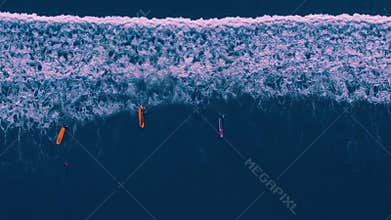 Aerial view of people surfing at Kuta beach, Bali Indonesia