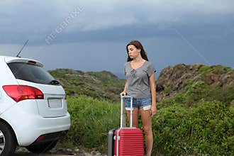 Frustrated car driver waiting for assistance after breakdown