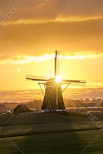 Sunrise on the Dutch windmill