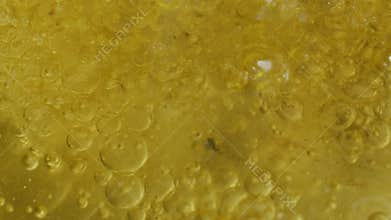 Abstract close-up on the surface of boiling water and oil