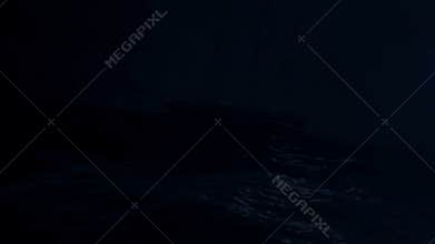 Sailboat drifting in a middle of a big storm at sea