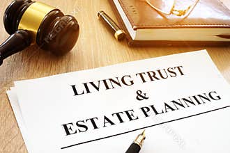 Living trust and estate planning form on desk.