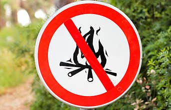 Sign or symbol no campfire, do not light a fire. No Campfires sign, in nature by sea. No open flame sign.