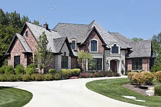Large brick home with circular driveway