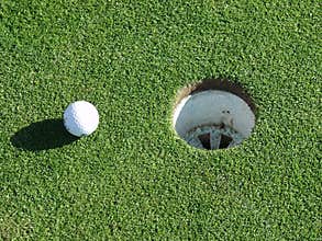 Golf ball and hole