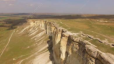 A flight over a plateau with white rocks torn from the ground. bird`s eye view.