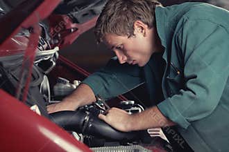 Mechanic fixing auto in car service