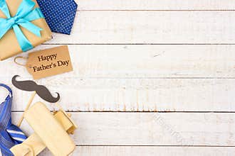 Happy Fathers Day gift tag with side border of gifts, ties and decor on white wood