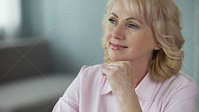 Middle-aged lady dreaming about retirement and around world cruise with her man