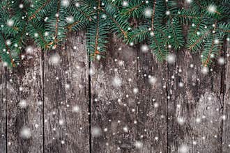 Christmas Fir branches on wooden background. Xmas and Happy New Year composition.