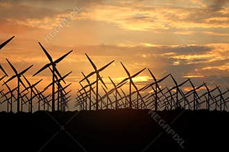 3D rendering of windmills producing engergy in the evening