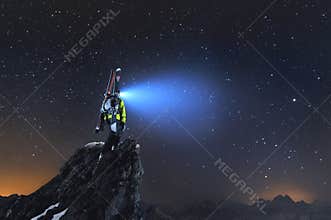 Night landscape. A professional backcountry skier with a backpack and skis stands on a rock in the mountains and shines