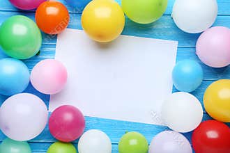 Balloons with sheet of blank paper