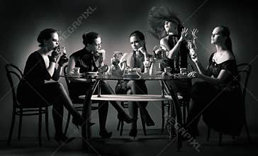 Five beauty girls tea drinking at the table