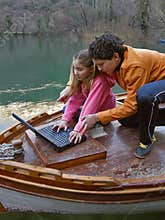 Brother and sister with laptop