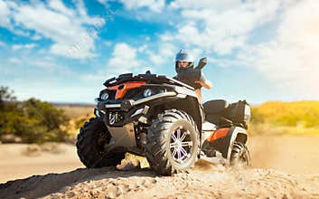 Summer offroad adventure on atv in sand quarry