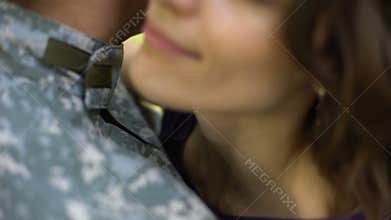 Woman hugging military husband, air forces serviceman leaving for work, couple