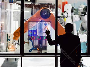 Engineer touch screen control the production of factory parts manufacturing industry robots