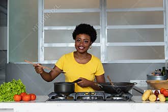 African american woman enjoys cooking healthy food