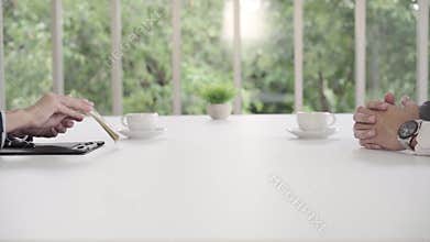 Slow motion - Businessman signing a home contract and check agreement. Businessman giving money while making deal.