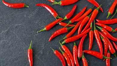 Red chili or cayenne pepper on stone surface