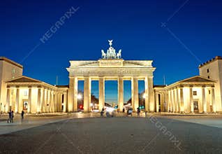 The illuminated Brandenburg Gate at dawn