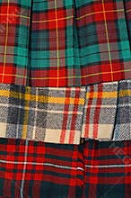 Colorful tartan plaid kilts in vertical image